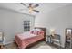 Cozy bedroom featuring a ceiling fan and a natural light from the window at 1123 Dora Parc Ln, Mount Dora, FL 32757