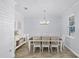 Dining room with a table and seating for eight, a buffet, and wood-look flooring at 1123 Dora Parc Ln, Mount Dora, FL 32757