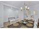 Dining room area with a wooden table and a buffet, and wood-look floors at 1123 Dora Parc Ln, Mount Dora, FL 32757