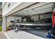 Spacious garage featuring a bass boat with equipment and lots of room for storage at 1123 Dora Parc Ln, Mount Dora, FL 32757