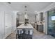 Well-equipped kitchen with modern appliances and a walkout to the deck at 1123 Dora Parc Ln, Mount Dora, FL 32757