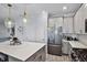 Bright modern kitchen with an island, stainless appliances and open floor plan at 1123 Dora Parc Ln, Mount Dora, FL 32757