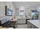 Spacious kitchen with gray cabinets, stainless steel appliances, a gas range, and plenty of counter space at 1123 Dora Parc Ln, Mount Dora, FL 32757