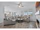 Bright and airy living room featuring a modern fireplace and large sectional at 1123 Dora Parc Ln, Mount Dora, FL 32757