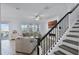 Cozy living room with a fireplace and staircase at 1123 Dora Parc Ln, Mount Dora, FL 32757