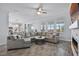 Bright and airy living room with a large sectional sofa and modern fireplace at 1123 Dora Parc Ln, Mount Dora, FL 32757