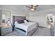 Bright main bedroom leading to ensuite, with stylish decor and soft lighting at 1123 Dora Parc Ln, Mount Dora, FL 32757