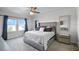 Elegant main bedroom with large windows, carpet, fan, and inviting decor at 1123 Dora Parc Ln, Mount Dora, FL 32757