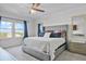 Bright main bedroom featuring natural light, modern decor, and stylish furnishings at 1123 Dora Parc Ln, Mount Dora, FL 32757