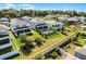 Aerial view of backyard showing a pool and a screened-in patio area and green landscaping at 1123 Dora Parc Ln, Mount Dora, FL 32757