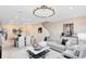 Bright, open-concept living room and dining area feature modern decor and ample space for entertaining at 11360 Blue Bay Dr, Orlando, FL 32832