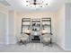 Bright office space featuring symmetrical design with built-in shelving and stylish decor at 11360 Blue Bay Dr, Orlando, FL 32832