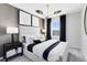 Stylish main bedroom with a large window, modern decor, and elegant lighting at 11368 Blue Bay Dr, Orlando, FL 32832