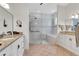 Bright bathroom with double sinks and walk in shower and tub at 1166 Adair Park Pl, Orlando, FL 32804