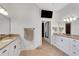 Bright bathroom with double sinks and a doorway leading to another room at 1166 Adair Park Pl, Orlando, FL 32804