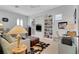 Bright bedroom with built in shelving, a desk and a sitting area at 1166 Adair Park Pl, Orlando, FL 32804