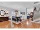 Elegant dining area with a table set for six, hardwood floors, and an open floor plan at 1166 Adair Park Pl, Orlando, FL 32804