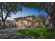 Charming two-story home with manicured lawn, mature landscaping, and a paver driveway at 1166 Adair Park Pl, Orlando, FL 32804
