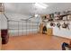 Spacious garage with shelving, overhead lighting, and ample room for parking and storage at 1166 Adair Park Pl, Orlando, FL 32804