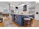 Modern kitchen featuring a large center island, white cabinets, and hardwood floors at 1166 Adair Park Pl, Orlando, FL 32804