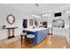 Bright kitchen featuring a blue island, a white countertop, and stainless steel appliances at 1166 Adair Park Pl, Orlando, FL 32804