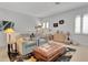 Cozy living area with armchairs, ottoman, and decorative rug near a bright window at 1166 Adair Park Pl, Orlando, FL 32804