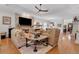 Bright living room with hardwood floors and stone fireplace and large screen television at 1166 Adair Park Pl, Orlando, FL 32804