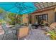 Outdoor patio with ample seating, pergola, lush landscaping, and a sun umbrella at 1166 Adair Park Pl, Orlando, FL 32804