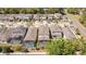 A neighborhood aerial view displaying backyard pools, complemented by neat landscaping and screened enclosures at 1311 Arisha Dr, Kissimmee, FL 34746