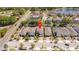 Aerial view of the property in its neighborhood with surrounding houses and streets at 1311 Arisha Dr, Kissimmee, FL 34746