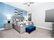 Comfortable bedroom featuring gray walls, neutral carpet, and coordinated furnishings at 1311 Arisha Dr, Kissimmee, FL 34746