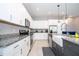 Well-equipped kitchen with granite countertops, stainless steel appliances, and ample cabinet space at 1311 Arisha Dr, Kissimmee, FL 34746