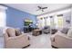 Bright living room with tile flooring, ceiling fan, and comfortable furnishings at 1311 Arisha Dr, Kissimmee, FL 34746