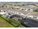 Aerial view of a home with screened-in patio, pool, and backyard for outdoor enjoyment at 13462 Panama Beach Ct, Orlando, FL 32827