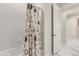 Clean bathroom featuring a shower with tiled walls and modern fixtures at 13462 Panama Beach Ct, Orlando, FL 32827