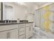 Bright bathroom featuring double sinks, granite counters, and a shower with decorative curtain at 13462 Panama Beach Ct, Orlando, FL 32827