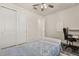 Comfortable bedroom with closet, ceiling fan, and a desk perfect for work or study at 13462 Panama Beach Ct, Orlando, FL 32827