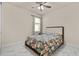Tranquil bedroom featuring floral bedding and a bright window view at 13462 Panama Beach Ct, Orlando, FL 32827