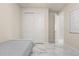 Cozy bedroom featuring closet, neutral tones, and a bright window view at 13462 Panama Beach Ct, Orlando, FL 32827