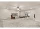 Expansive bonus room featuring carpet flooring, a bookcase, and a comfortable seating area at 13462 Panama Beach Ct, Orlando, FL 32827