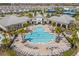 Resort-style pool with lounge chairs, palm trees, and umbrellas for relaxation and enjoyment at 13462 Panama Beach Ct, Orlando, FL 32827