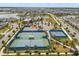 Aerial view of community amenities including tennis courts, basketball court, and clubhouse at 13462 Panama Beach Ct, Orlando, FL 32827