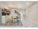 Dining area with marble floors, modern chandelier, and stairs nearby at 13462 Panama Beach Ct, Orlando, FL 32827
