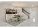 Dining area with marble floors, modern chandelier, and stairway at 13462 Panama Beach Ct, Orlando, FL 32827