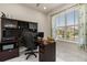 Bright home office with a built-in desk, modern finishes, and a large window for natural light at 13462 Panama Beach Ct, Orlando, FL 32827