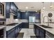 This gorgeous kitchen features sleek countertops, stainless steel appliances and modern tile flooring at 13462 Panama Beach Ct, Orlando, FL 32827