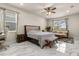 The main bedroom features an en suite bathroom and windows with backyard views at 13462 Panama Beach Ct, Orlando, FL 32827