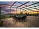 A scenic patio with comfortable seating perfect for enjoying peaceful evening sunsets over the water at 13462 Panama Beach Ct, Orlando, FL 32827