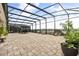 Large screened-in lanai offers stunning water views, perfect for relaxation and entertaining at 13462 Panama Beach Ct, Orlando, FL 32827