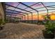 Expansive patio with a view of the lake, featuring comfortable seating and a dining area for enjoying outdoor meals at 13462 Panama Beach Ct, Orlando, FL 32827